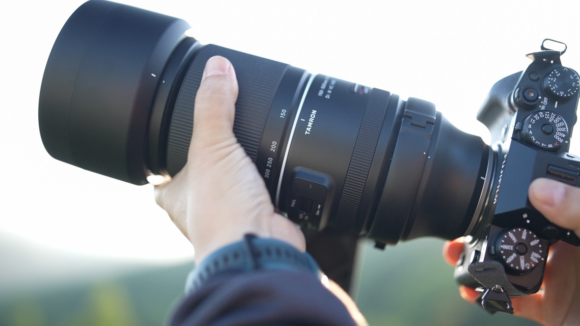 Start with an ultra-telephoto lens when you photograph sports at distance